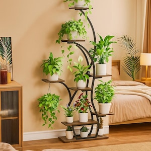 May include: A multi-tiered plant stand with a black metal frame and wooden shelves. The stand holds various potted plants with green foliage and white pots. The design is curved and adds a decorative element to the room.