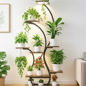 May include: A tall, black metal plant stand with multiple wooden shelves and built-in lighting. The stand holds various potted plants with green foliage and white pots, creating a modern indoor garden display. The stand is approximately 6 feet tall.