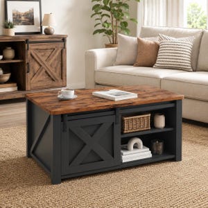 May include: A rectangular coffee table with a dark brown wood-grain top and a matte black base. It features a sliding barn-style door with an X-pattern, two open storage shelves, and black metal hardware, including a rail for the sliding door.