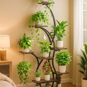May include: A multi-tiered plant stand with a black metal frame and wooden shelves. The stand displays various potted plants with green foliage and white pots. The design is a decorative way to showcase indoor plants, adding a touch of nature to a room.