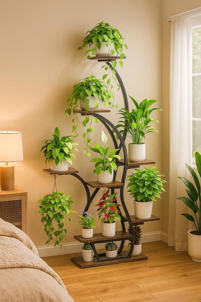 May include: A multi-tiered plant stand with a black metal frame and wooden shelves. The stand displays various potted plants with green foliage and white pots. The design is a decorative way to showcase indoor plants, adding a touch of nature to a room.