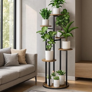 May include: A tall, multi-tiered plant stand with a black metal frame and wooden shelves. The stand holds several potted plants with lush green foliage. The stand is in a living room setting, next to a sofa and a window.