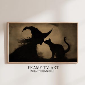 Op de afbeelding: Een ingelijste print met een zwart silhouet van een heks met een puntmuts, die een zwarte kat kust. Het kunstwerk is in zwart- en sepia tinten, met de tekst "FRAME TV ART INSTANT DOWNLOAD" onderaan.