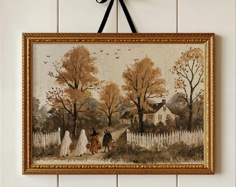 Op de afbeelding: Een rechthoekige ingelijste print met een landschapsschilderij van vier figuren in kostuum die naar een huis lopen. De scène bevat gouden herfstbomen, een wit lattenhek en een zwart lint gestrikt aan de bovenkant van de gouden lijst.