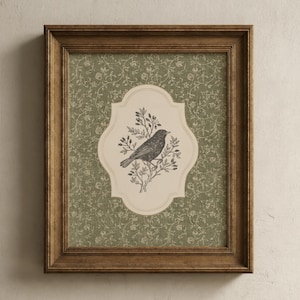 May include: A framed print featuring a detailed illustration of a bird perched on a branch. The bird is set against a cream-colored, ornate backdrop within a decorative frame. The frame is a warm brown color, and the background is a green floral pattern.