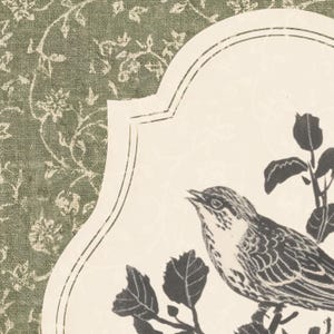 May include: A decorative print featuring a detailed illustration of a bird perched on a leafy branch. The bird is rendered in black and white against a cream-colored backdrop with a floral design. The background has a green floral pattern.