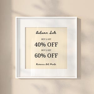 May include: A framed print with the text "Autumn Sale" in a cursive font. The print offers 40% off when you buy 3 items and 60% off when you buy 5 items. The artist's name, "Karenina Art Prints," is at the bottom.