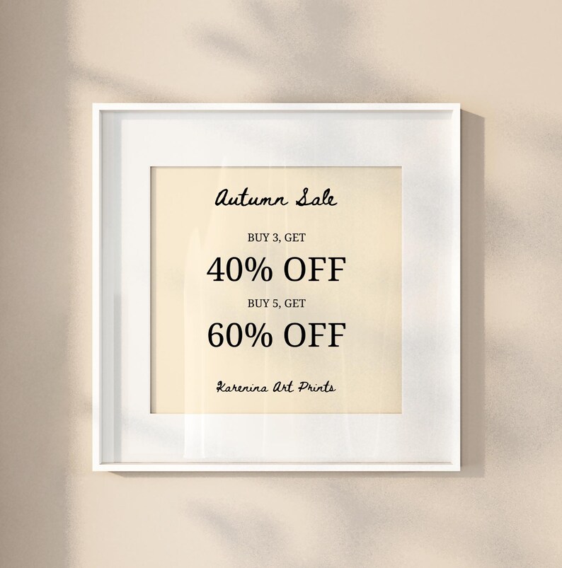 May include: A framed print with the text "Autumn Sale" in a cursive font. The print offers 40% off when you buy 3 items and 60% off when you buy 5 items. The artist's name, "Karenina Art Prints," is at the bottom.