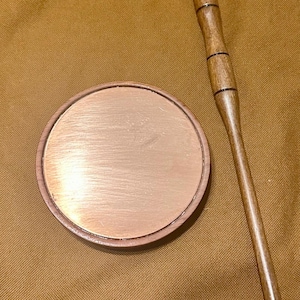 Copper top friction call. Copper over glass in a  Bubinga/African rosewood pot