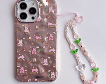 Belle coque pour iPhone 15/14/13/12/MAX/Lapins/lapins/fleurs/arbres/Lase brillant blanc/rose en TPU avec perles chaîne pour téléphone