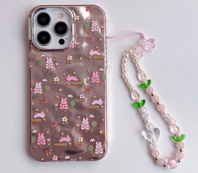 Lovely iPhone 15/14/13/12/MAX case/Cute Bunnies/Rabbits/Flowers/Trees/Shiny Lase White/Pink TPU Cover with Beads Phone Chain image 1