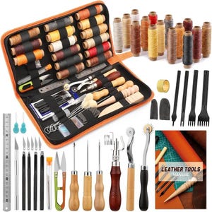May include: An open orange zipped case containing leathercraft tools, including spools of thread, various knives, needles, and wooden handled tools. Additional thread spools are arranged to the right. A ruler is visible on the left.