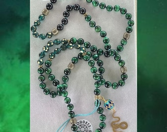 Mala de ojo de tigre verde de la colección Elphaba de inspiración malvada