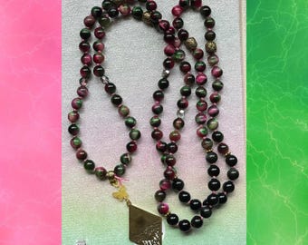 Mala de ojo de tigre rosa y verde de inspiración malvada