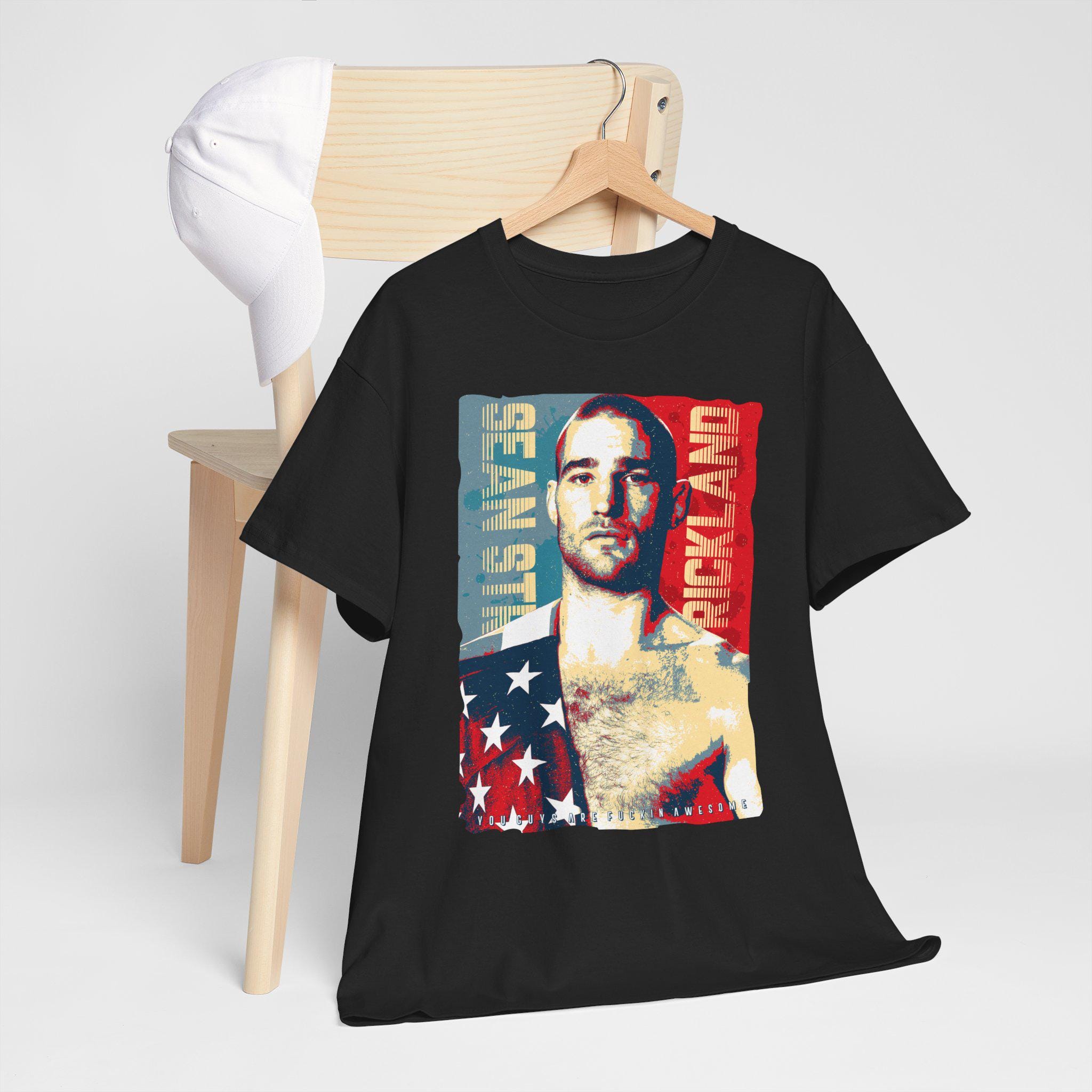 Sean Strickland 2024 A Woman In Every Kitchen A Gun In Every Hand Shirt, hoodie, sweater, long sleeve and tank top