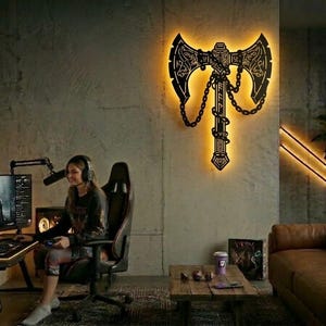 Viking battle axe silhouette for laser cutting and CNC. Professional Norse warrior weapon vector file in Svg Dxf format. High-detail metal wall art for LED backlit home decor from **dxfdesignco art**.