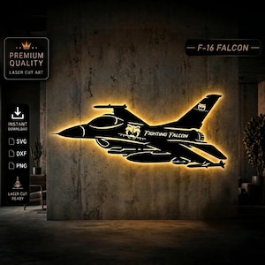 May include: Black laser-cut art of an F-16 Falcon fighter jet, illuminated with a warm glow. The design includes the text "FIGHTING FALCON" and "F-16 FALCON". The image also includes text that says "PREMIUM QUALITY LASER CUT ART" and "INSTANT DOWNLOAD".