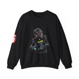 May include: Black sweatshirt featuring a neon outline of a football player in a helmet, holding a football. The number "5" is on the left sleeve in red and white. The player's jersey has the number "5" on it.