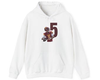 May include: White hooded sweatshirt featuring a maroon number 5 and a football player graphic. The player is wearing a maroon and gold uniform and holding a football. The sweatshirt has a front pocket and a drawstring hood.