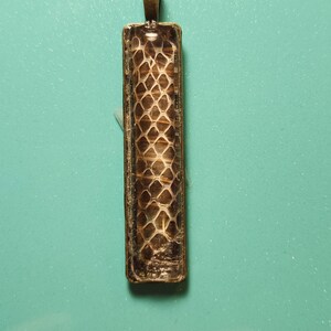 rectangular snake shed pendant. Ms1