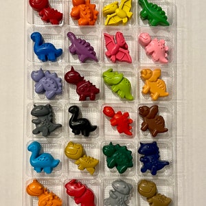 Advent calendar filled with 24 Dinosaur shaped crayons. Christmas countdown.