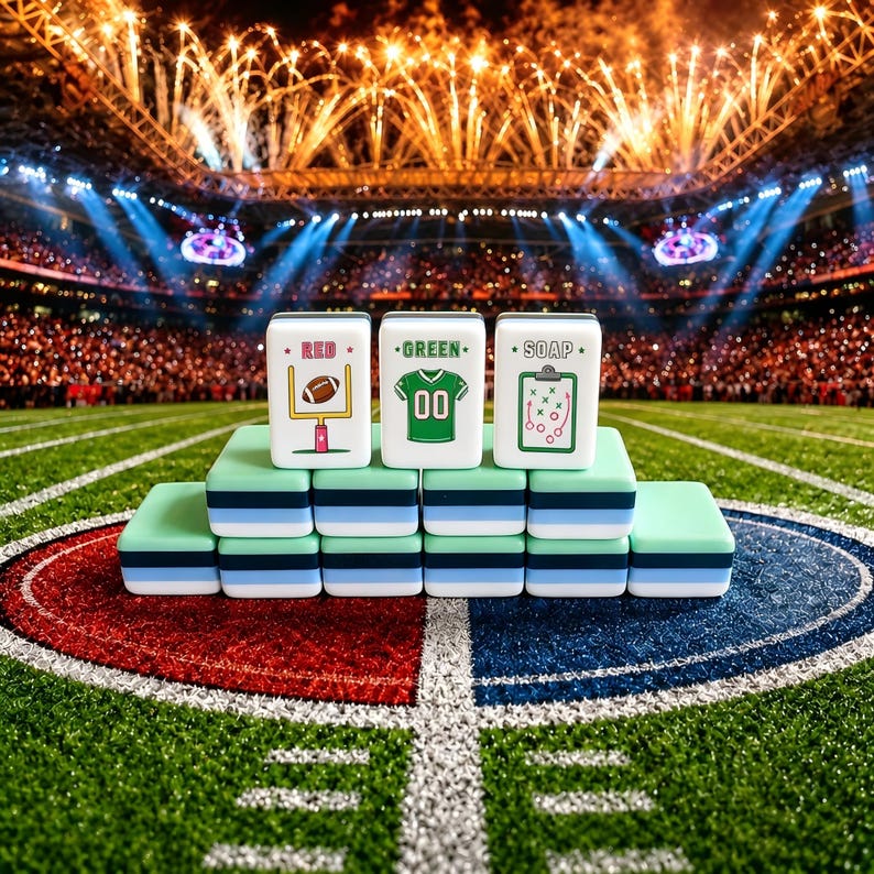 May include: A set of rectangular tiles stacked in a pyramid formation. The top three tiles feature illustrations of a football goalpost with the text RED, a green jersey with the number 00 and the text GREEN, and a clipboard with the text SOAP.