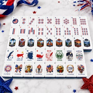 May include: A set of white mahjong tiles featuring patriotic American designs, including national park illustrations, red and blue stripes, stars, and floral motifs. Each tile displays specific numbers, cardinal directions, or the word flower.