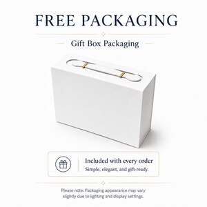 May include: A rectangular white gift box with a top handle featuring gold-colored metal accents. The text reads FREE PACKAGING, Gift Box Packaging, and Included with every order. Simple, elegant, and gift-ready. Please note: Packaging appearance may vary slightly due to lighting and display settings.
