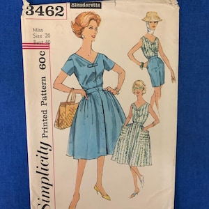 May include: A Simplicity 3462 Slenderette sewing pattern envelope for Miss Size 20, Bust 40. The illustration features three variations of a light blue dress with a V-neckline, short sleeves, and a button-front closure, including one with pockets.
