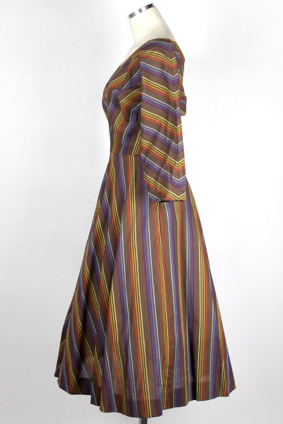 Vintage 1950s full swing dress with rainbow stripes in chevron style pattern dolman sleeve