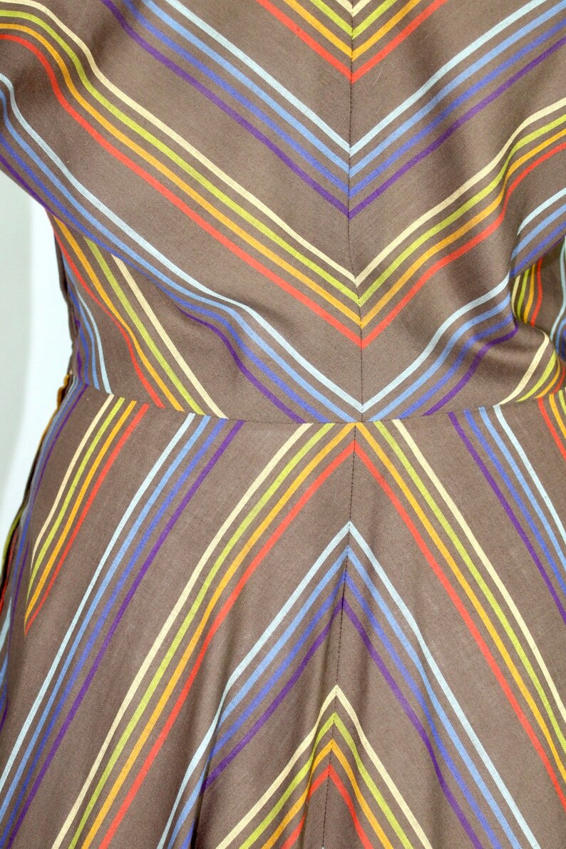 Vintage 1950s full swing dress with rainbow stripes in chevron style pattern dolman sleeve