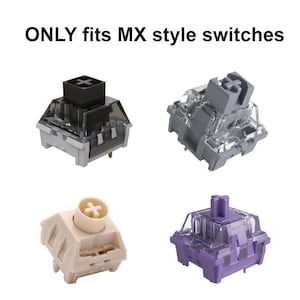 May include: Four mechanical keyboard switches in different colors: black, gray, cream, and purple. Each switch has a clear plastic housing and a colored stem. The text "ONLY fits MX style switches" is at the top.