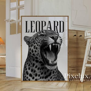 May include: Black and white framed print featuring a roaring leopard with the word "LEOPARD" in bold letters at the top. The image showcases the leopard's open mouth and sharp teeth, creating a striking visual.
