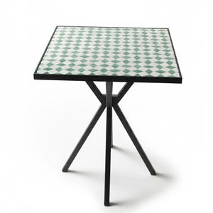 May include: Square side table with a black metal frame and a tabletop featuring a green and white diamond pattern. The table has a three-legged base. The tabletop measures approximately 24 inches square.