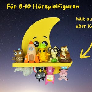 May include: A yellow crescent moon shelf with cartoon figurines, including an owl, rocket, pineapple, dog, and another owl. The shelf is designed to hold 8-10 figurines. The background is a starry night sky.