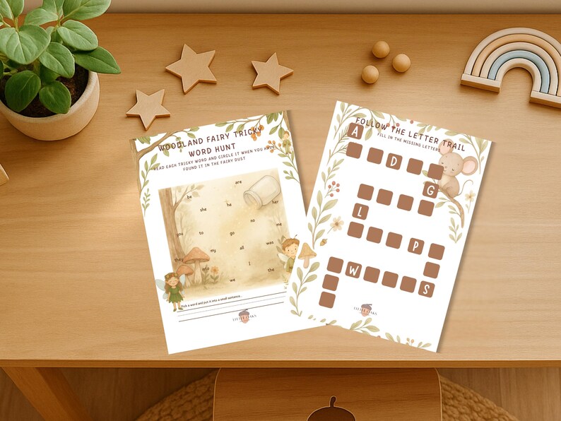 Op de afbeelding: Twee educatieve werkbladen voor kinderen. E&eacute;n blad is een woordzoeker met de tekst "Woodland Fairy Tricky Word Hunt". Het andere blad is een letterpad met een muisillustratie en de tekst "Follow the Letter Trail".