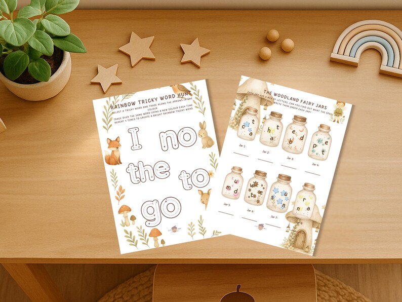Op de afbeelding: Twee afdrukbare werkbladen voor kinderen. E&eacute;n blad heeft de titel "Rainbow Tricky Word Hunt" met de woorden "I no the to go" en illustraties van een vos, konijn en paddenstoelen. Het andere blad heeft de titel "The Woodland Fairy Jars".