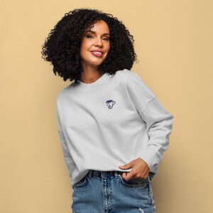 Women’s organic crew neck sweatshirt with hand drawn embroidered tea cup design