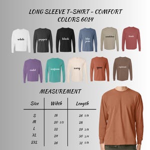 May include: A display of long-sleeve t-shirts in various colors, including white, black, and blue jean. The image includes a size chart with measurements in inches for width and length. The text reads "LONG SLEEVE T-SHIRT - COMFORT COLORS 6014."