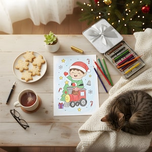 Fully colored Christmas elf-on-train coloring page on a festive wooden table with cookies, tea, colored pencils, and a cat resting nearby.