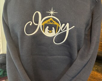 Sudadera azul marino con bordado «Joy»: Escena navideña de la Natividad