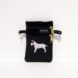 May include: Black zippered pouch with a white embroidered bull terrier and the text "Dixie Bags" on the front.