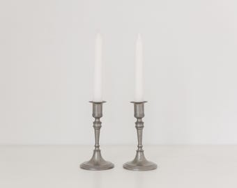 Vintage pair of pewter candle stick holders