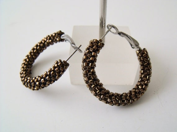 Woven bead hoop best sale earrings
