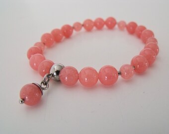 Beaded pink quartz stretch bracelet with stainless steel quartz dangle