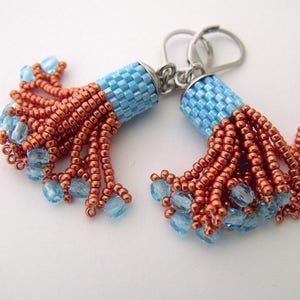 Woven beaded tassel earrings copper blue glass dangles