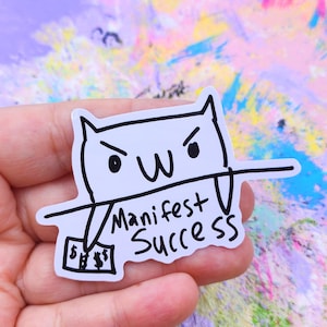 Manifest Success Greed Cat Sticker: Waterproof Vinyl Decal