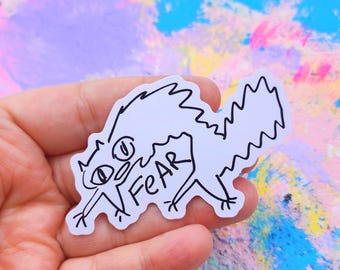 Fear Greed Cat Sticker: Glossy Vinyl, Indoor/Outdoor Use (3 inch)