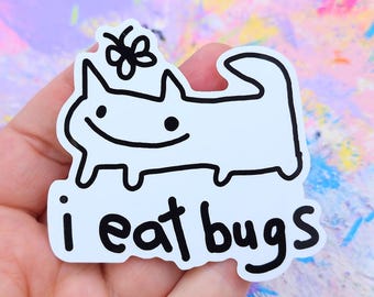 May include: A white sticker featuring a cartoon cat with a butterfly above its head. The cat has a smiling face and the words "i eat bugs" in black text below it. The sticker is on a colorful, abstract background.