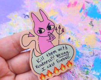 May include: A pink cartoon devil sticker with the text "Kill them with Kindness?? Wrong. I cast fireball." The sticker features a devilish bunny with a pitchfork and flames.